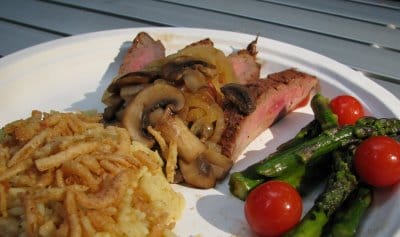 Camping Cuisine – Flank Steak with Caramelized Onions and Mushrooms alongside Asparagus and Tomatoes