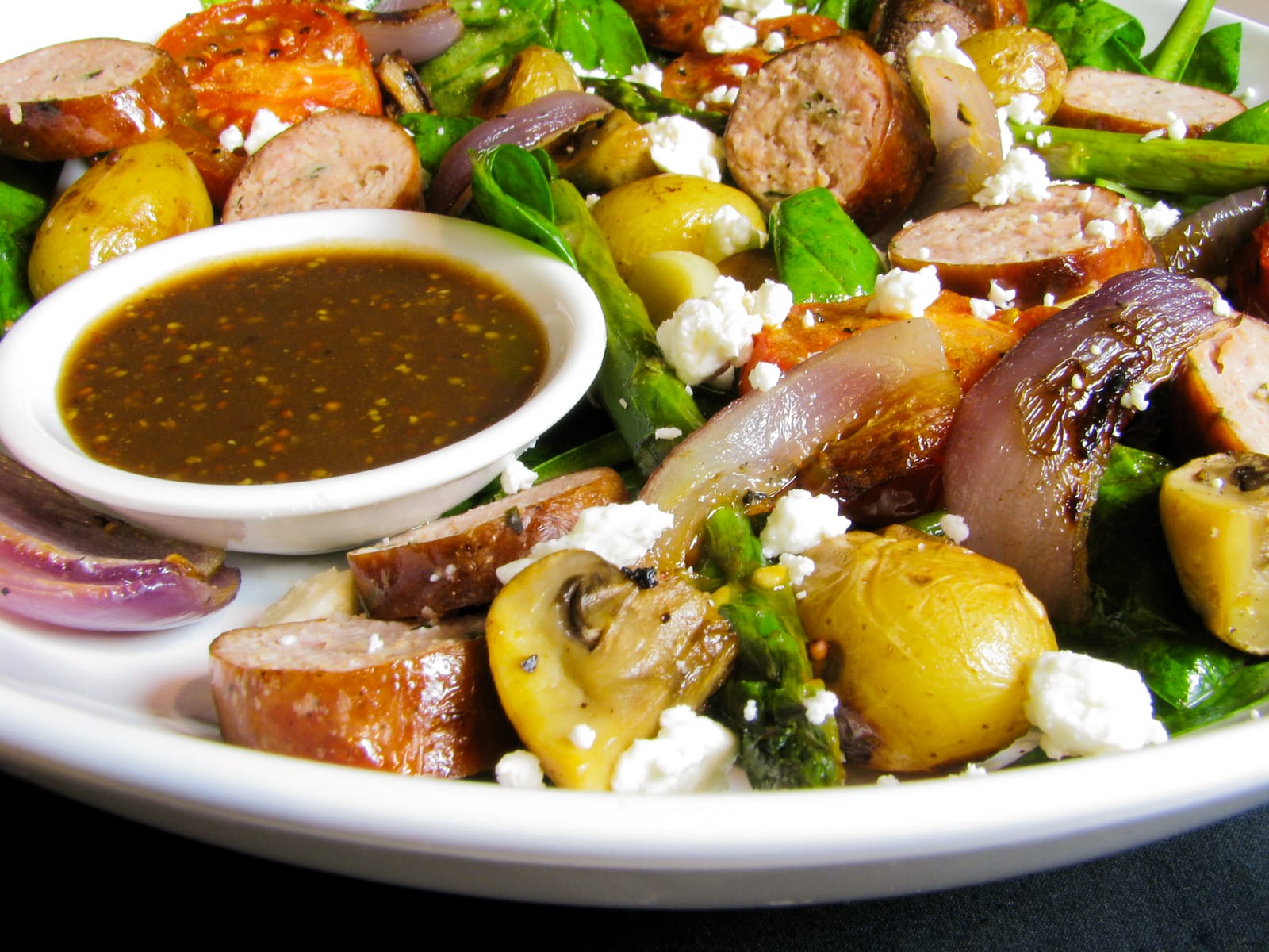 Warm Spinach Salad with Sausage and Potatoes