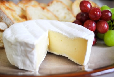 Brie served with Crostini and Grapes