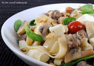 Fettuccine with Italian Sausage, Mushrooms, Tomatoes, Spinach, Pine Nuts, and Basil