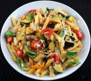 Penne with Mixed Vegetables, Parmesan Cheese, and Pine Nuts