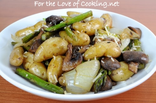 Roasted Baby Potatoes, Mushrooms, Onions, and Asparagus Topped with Parmesan Cheese
