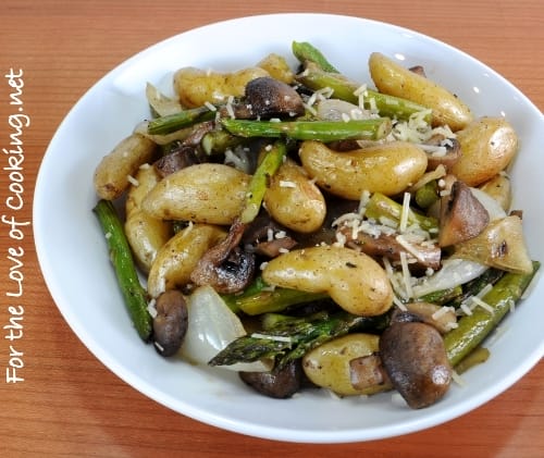 Roasted Baby Potatoes, Mushrooms, Onions, and Asparagus Topped with Parmesan Cheese