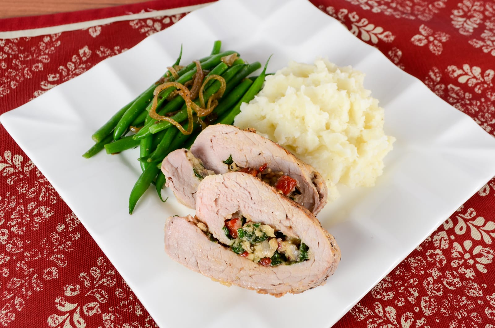 Pork Tenderloin Stuffed with Spinach, Roasted Bell Pepper, Mushroom, and Parmesan
