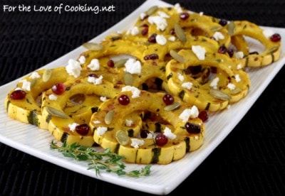 Herb Roasted Delicata Squash Topped With Pomegranate Seeds, Pepitas, and Feta