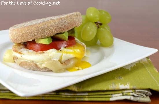 Breakfast Sandwich with Egg, Avocado, Tomato, and Swiss Cheese