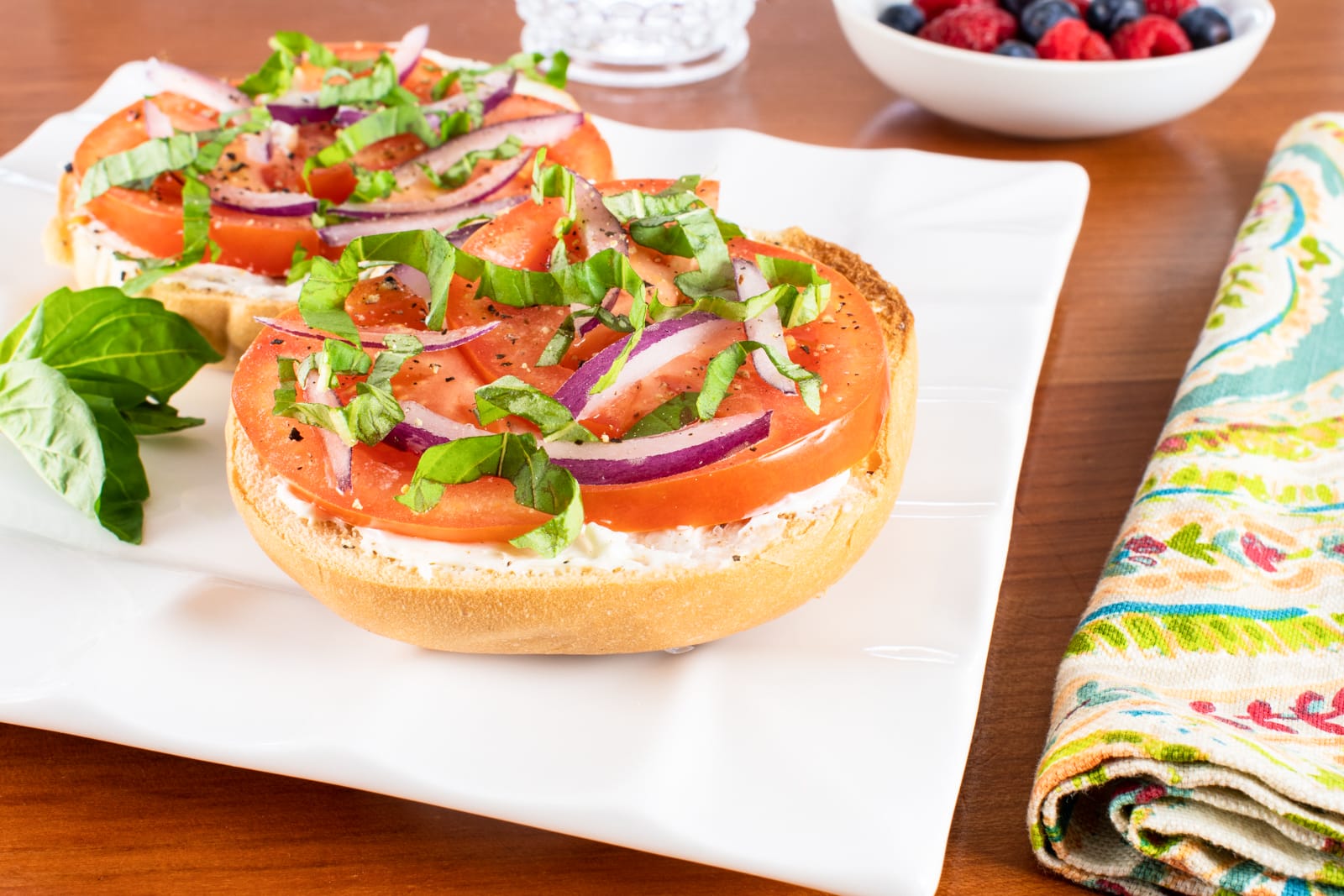 Open Faced Bagel with Cream Cheese, Tomato, Red Onion, and Fresh Basil