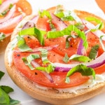Open Faced Bagel with Cream Cheese, Tomato, Red Onion, and Fresh Basil