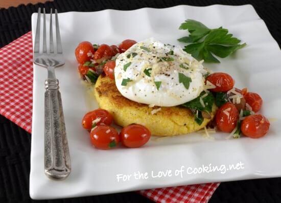 Polenta Cake Topped with Sautéed Tomatoes, Spinach, and a Poached Egg