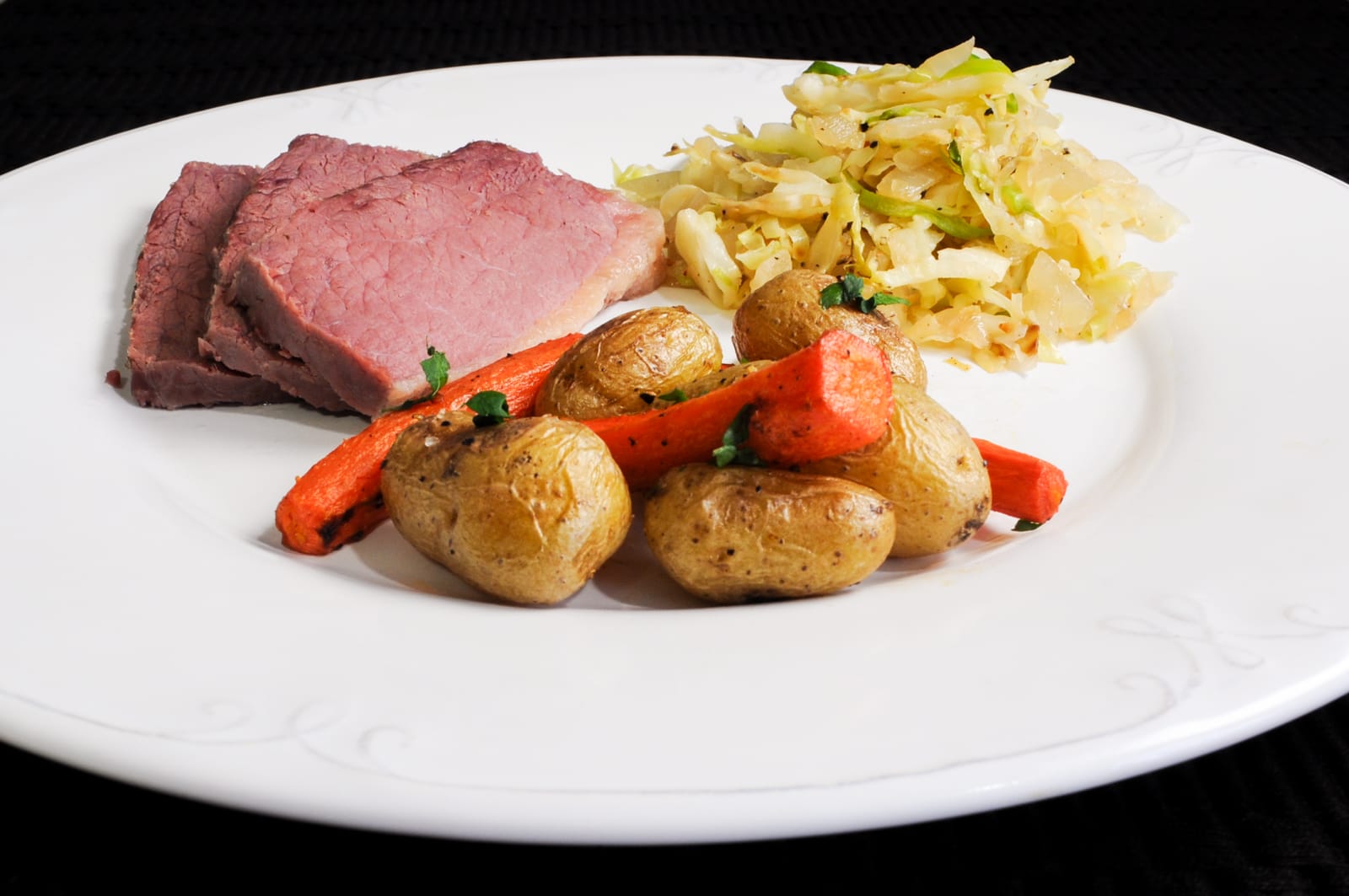 Boiled Corned Beef, Sautéed Cabbage & Onions, and Roasted Carrots & Potatoes